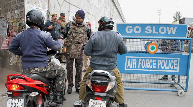 Pathankot: Security personnel check IAF employees near the Indian Air Force base in Pathankot during the third day of the operations against militants on Monday. PTI Photo (PTI1_4_2016_000067B)