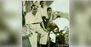 Mahatma gandhi touching ambedkars feet